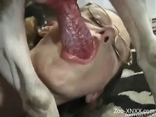 Blonde gets to suck this dog's meaty cock indoors