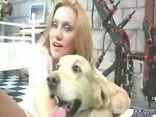 Blonde dressed in white fucking a white dog