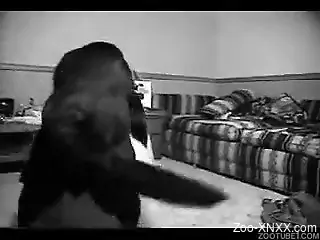 Black and white footage featuring a brunette with a dog