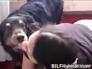 Black t-shirt brunette sucking this big dog cock