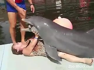 Old lady gets dry-humped by a really horny dolphin