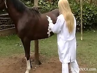 Naughty nurse guides a horse's cock deep inside