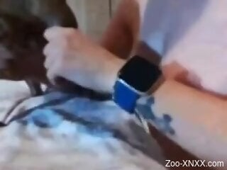 Hot slut gets naked on cam and sucks her dog's dick like a pro
